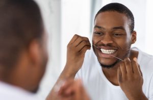 Dental Flossing Mistakes - Man Flossing